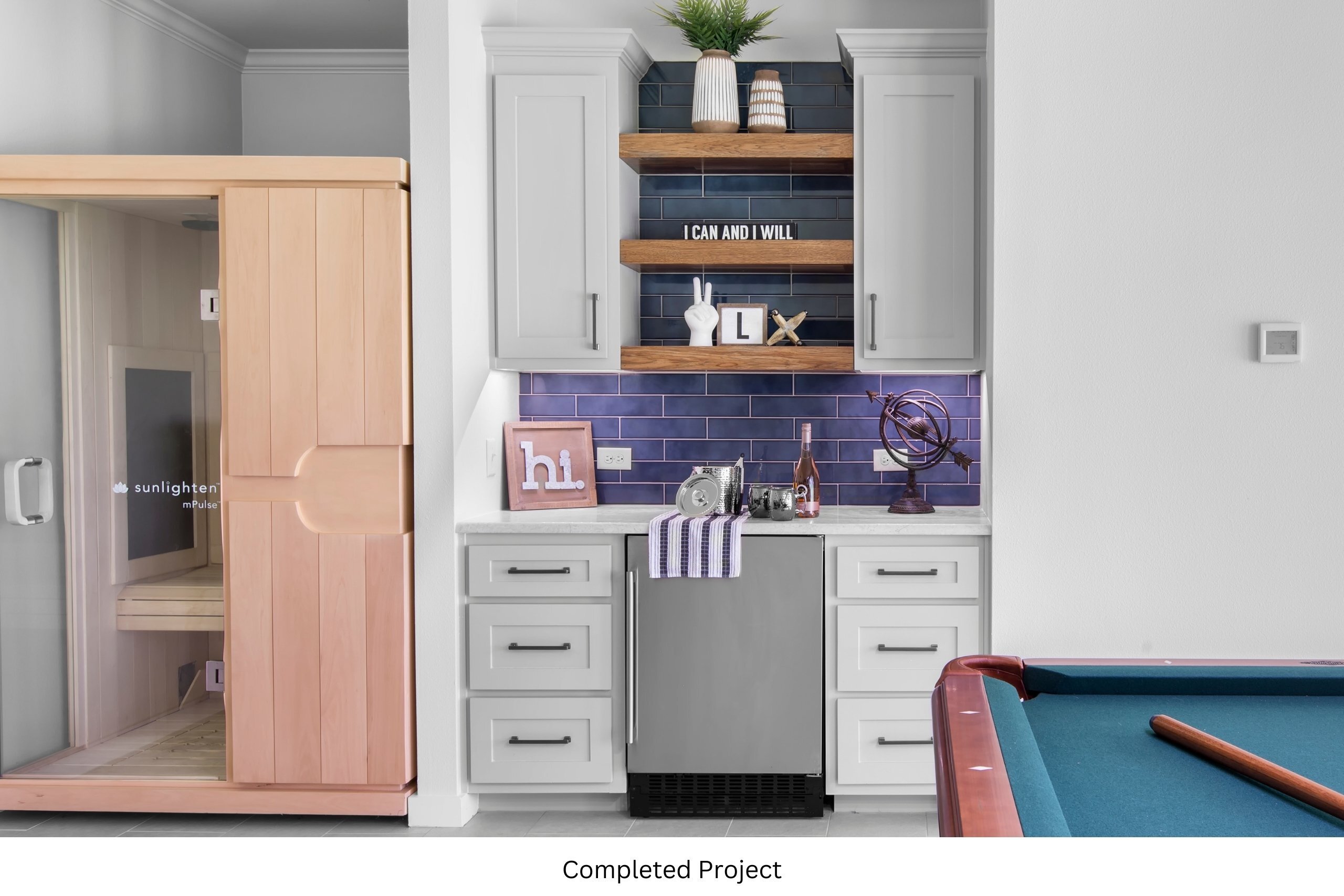 Photo of a game room, highlighting the built in bar and sauna. 