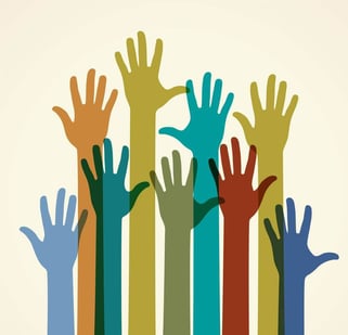 Colorful raised hands. The concept of diversity. Group of hands.
