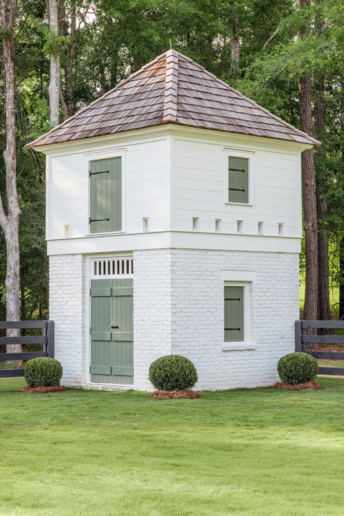White limewash brick on a small carriage house