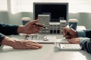 home insurance agent Signing a contract to buy and sell a house