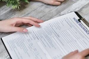 Person Holding form of Home Insurance