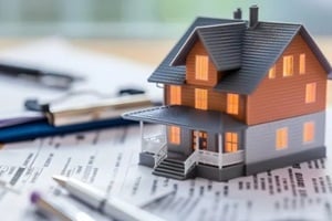 real estate agent and customer shaking hands after finished contract about home insurance and investment loan realtor signing mortgage agreement for new home with couple of happy young