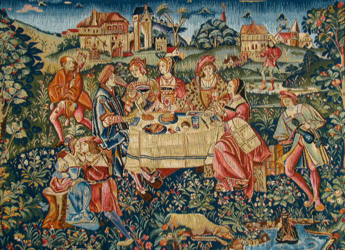 This is a Medieval painting of several people enjoying a banquet.