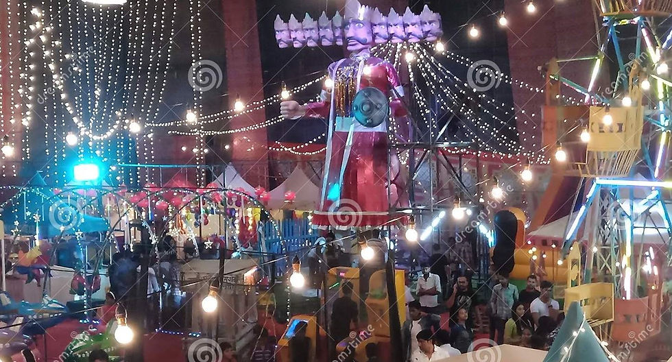 This is a picture of the Indian Festival "Dussehra." There are strings of lights, a Ferris wheel, several outdoor tents, and people walking around.