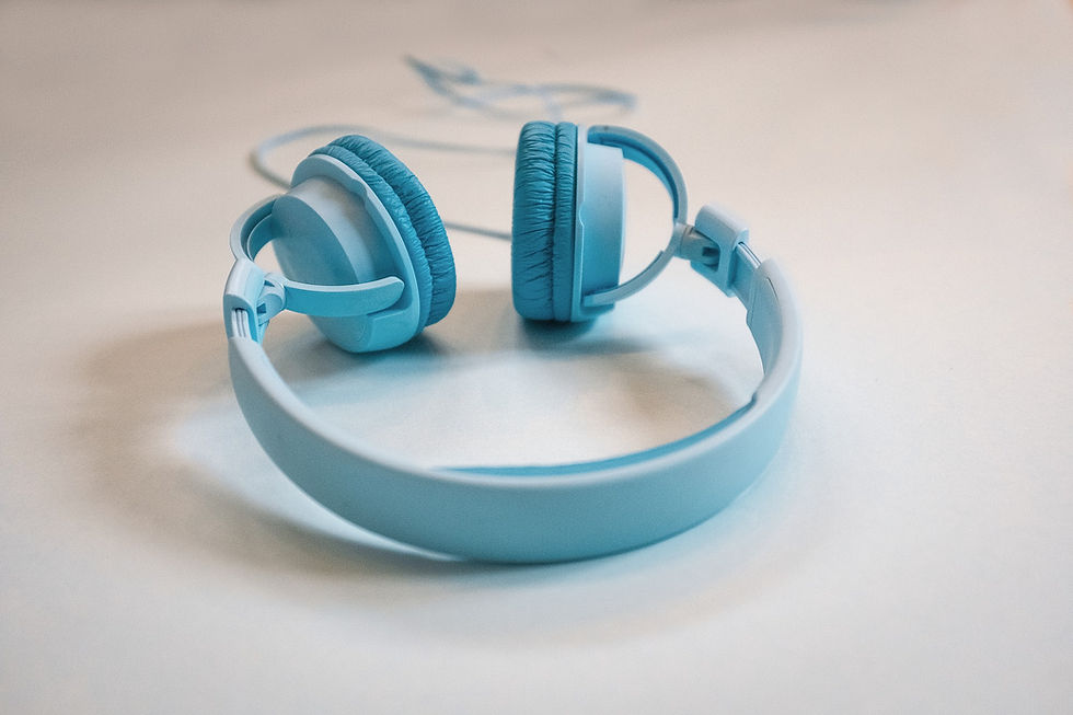 This is a picture of light blue headphones on a white background.