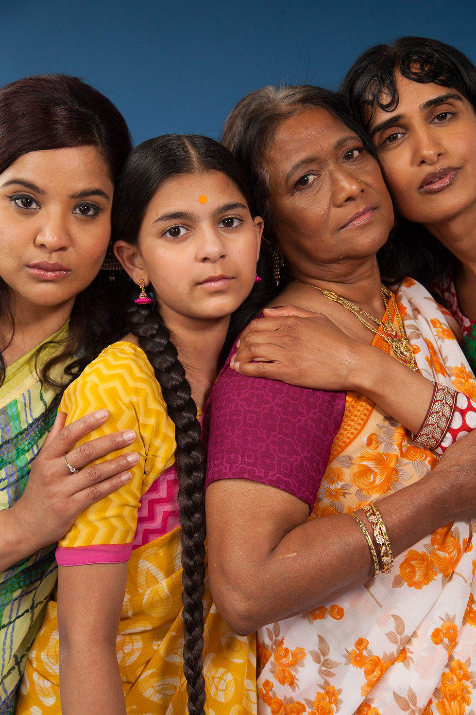 This is a picture of four Indian women wearing Sarees. 