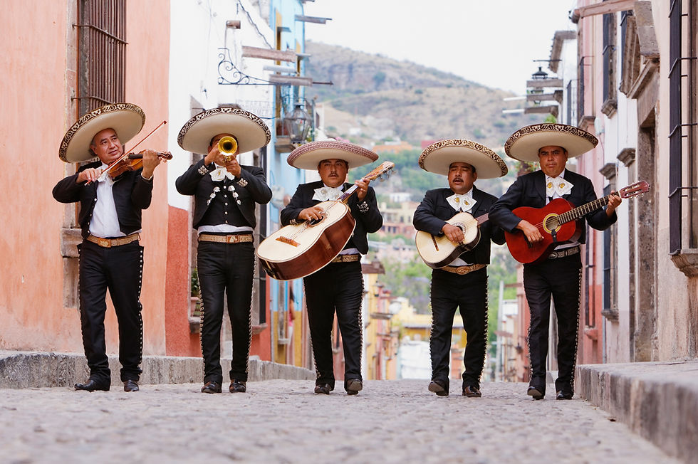 This is a picture of a Mariachi band walking down a street.