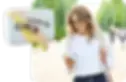 a woman looking at her phone browsing for eyewear