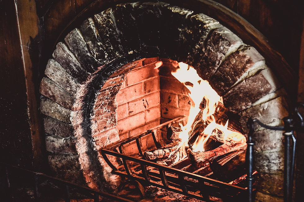 A crackling fire in a stone hearth.