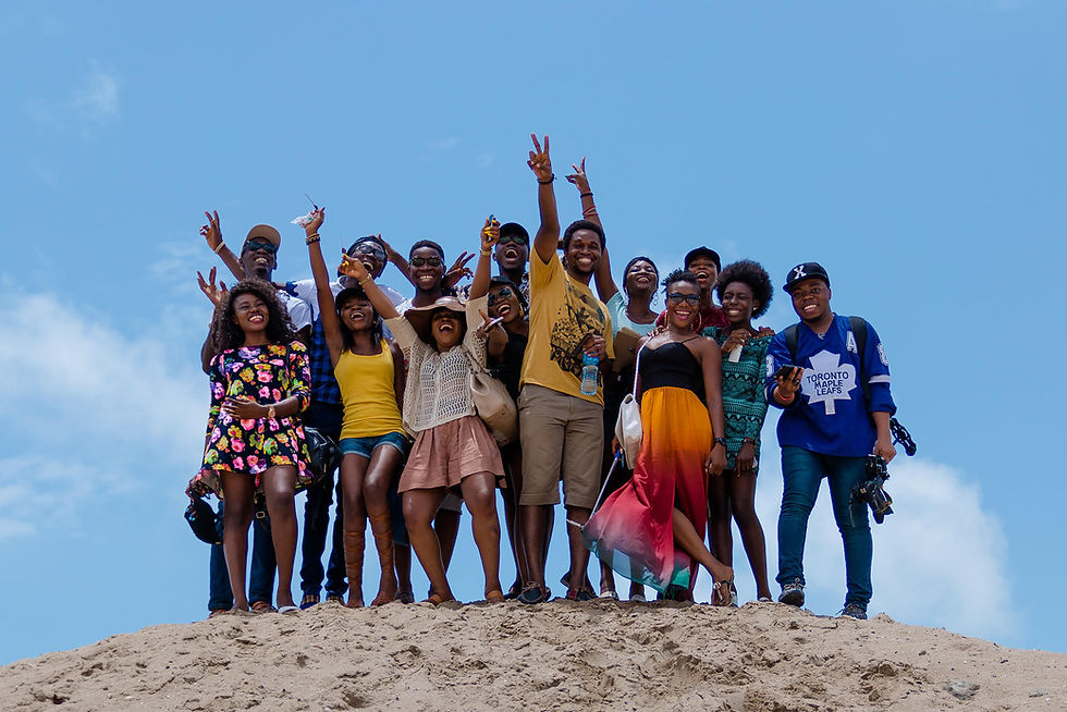 A group of black people enjoying the beach.