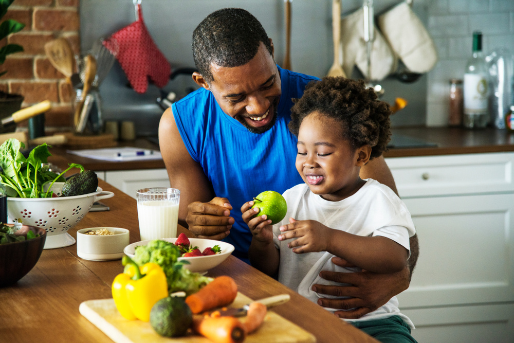 a person and a child preparing food